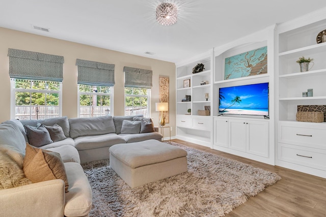 9829 English Elm St, Ladson, SC 29456 - living room featuring wood finished floors and built in shelves