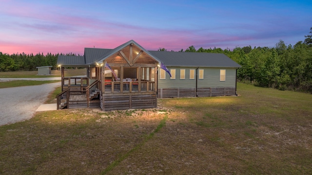 5653 Wire Rd, Branchville, SC 29432 - view of front of property with a porch, a front lawn, and metal roof