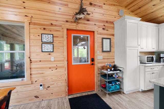 5653 Wire Rd, Branchville, SC 29432 - doorway to outside with wooden walls, lofted ceiling, light wood finished floors, and wood ceiling