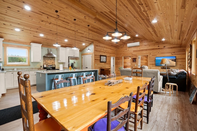 5653 Wire Rd, Branchville, SC 29432 - dining area featuring light wood-style floors, wood ceiling, wood walls, lofted ceiling, and recessed lighting