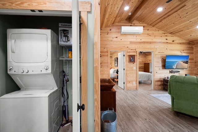 5653 Wire Rd, Branchville, SC 29432 - laundry room featuring stacked washer and clothes dryer, an AC wall unit, wood ceiling, and wood walls