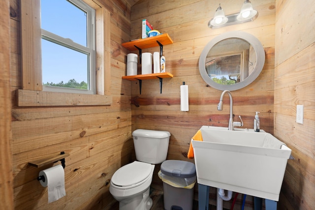 5653 Wire Rd, Branchville, SC 29432 - bathroom with wood walls, a sink, and plenty of natural light