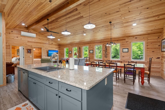 5653 Wire Rd, Branchville, SC 29432 - kitchen featuring open floor plan, wood walls, gray cabinets, and a sink