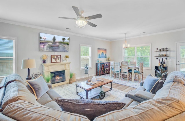 266 Torslanda Ln, Summerville, SC 29486 - living room featuring crown molding, wood finished floors, baseboards, a chandelier, and ceiling fan