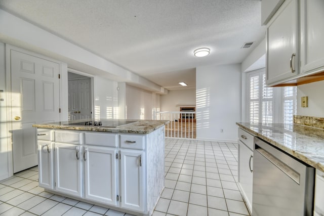 kitchen featuring light tile patterned floors, black electric stovetop, white cabinetry, stainless steel dishwasher, and a center island