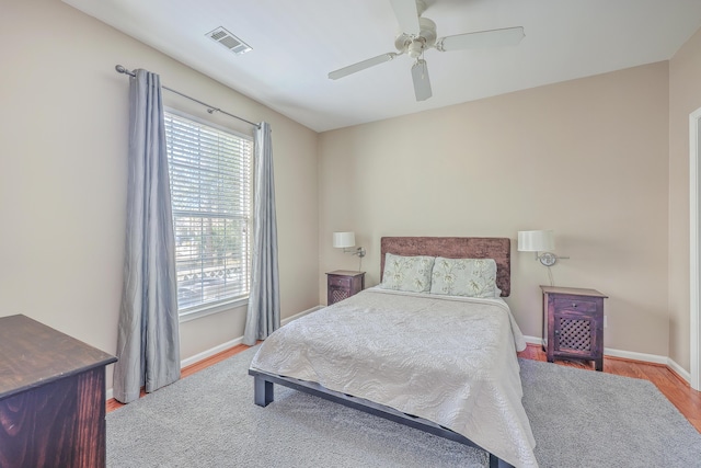 bedroom with ceiling fan and light wood-type flooring