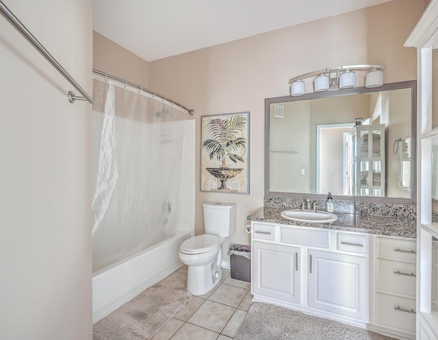 full bathroom featuring tile patterned flooring, vanity, toilet, and shower / bathtub combination with curtain