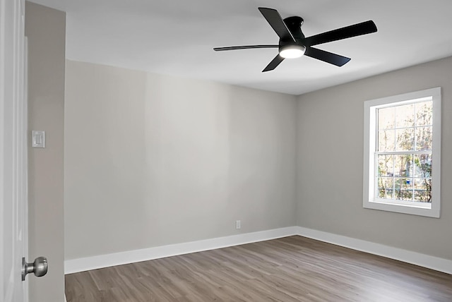 empty room featuring ceiling fan and hardwood / wood-style floors