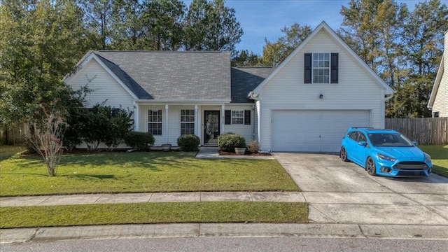 view of front of house featuring a front yard and a garage