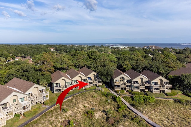 aerial view with a residential view and a wooded view