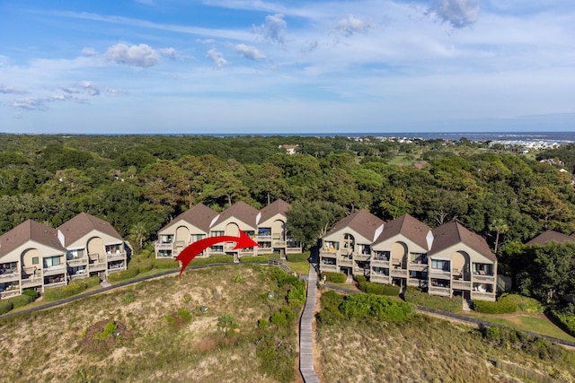 bird's eye view featuring a view of trees and a residential view