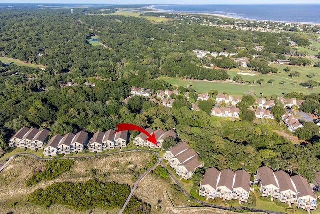 birds eye view of property featuring a residential view and a view of trees