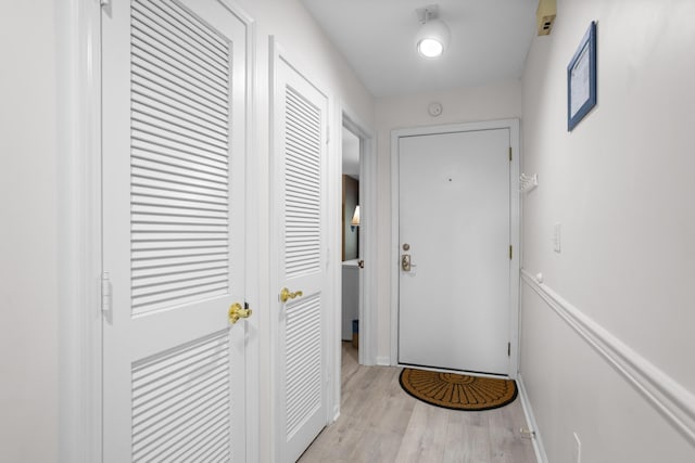 doorway to outside featuring light wood-type flooring