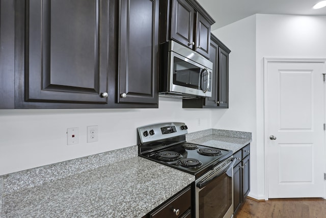 316 Knawl Rd, Moncks Corner, SC 29461 - kitchen with appliances with stainless steel finishes, dark wood finished floors, and light stone counters