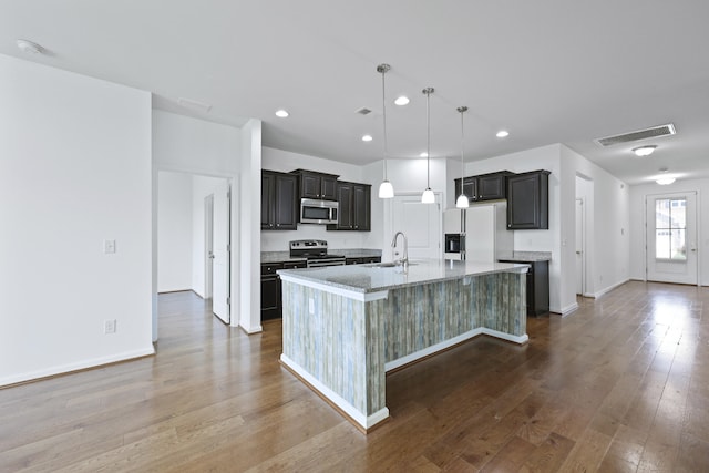 316 Knawl Rd, Moncks Corner, SC 29461 - kitchen featuring stainless steel appliances, a center island with sink, dark wood finished floors, pendant lighting, and recessed lighting