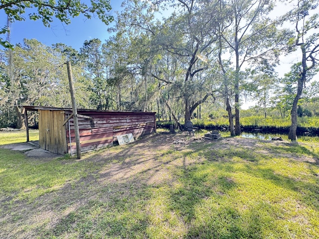 4589 Prices Bridge Ln, Walterboro, SC 29488 - view of green lawn with an outdoor structure