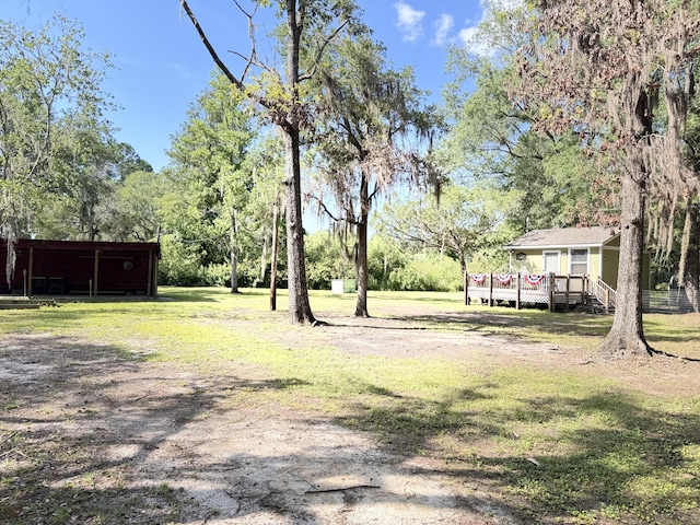4589 Prices Bridge Ln, Walterboro, SC 29488 - view of green lawn featuring a wooden deck