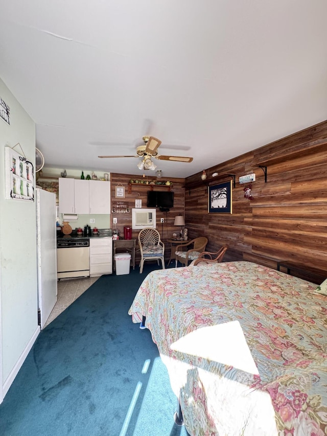 4589 Prices Bridge Ln, Walterboro, SC 29488 - bedroom featuring freestanding refrigerator, carpet, wood walls, and ceiling fan