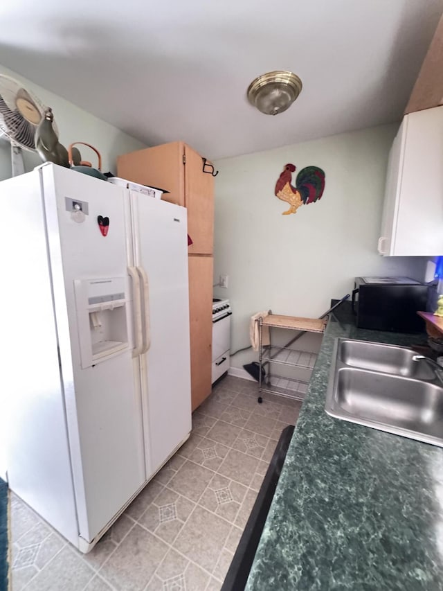 4589 Prices Bridge Ln, Walterboro, SC 29488 - kitchen featuring white refrigerator with ice dispenser, light tile patterned floors, and dark countertops