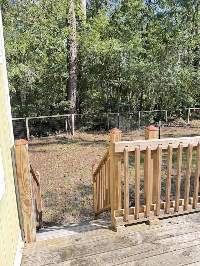 4589 Prices Bridge Ln, Walterboro, SC 29488 - wooden terrace featuring a fenced backyard and view of wooded area
