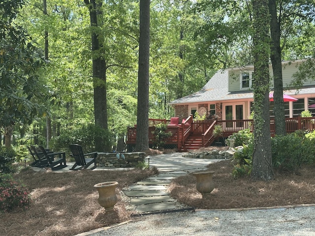 206 Chaussee Blvd, Summerville, SC 29483 - view of front of house featuring french doors, a fire pit, and a deck