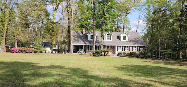 206 Chaussee Blvd, Summerville, SC 29483 - cape cod house with a front yard, a chimney, and brick siding