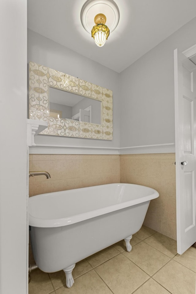 206 Chaussee Blvd, Summerville, SC 29483 - bathroom featuring a freestanding bath, tile walls, tile patterned flooring, and wainscoting