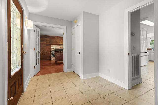 206 Chaussee Blvd, Summerville, SC 29483 - entryway with light tile patterned floors, wood walls, baseboards, and a fireplace
