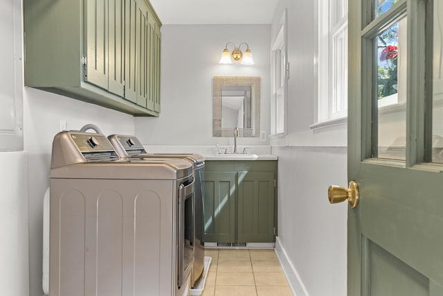 206 Chaussee Blvd, Summerville, SC 29483 - washroom featuring cabinet space, washing machine and clothes dryer, light tile patterned floors, and baseboards