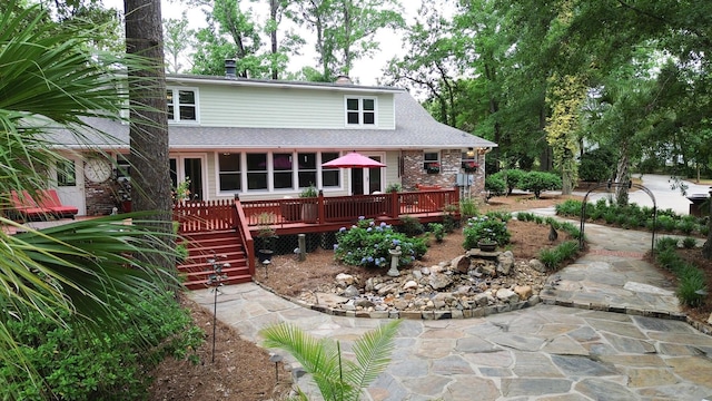 206 Chaussee Blvd, Summerville, SC 29483 - rear view of property featuring a wooden deck, brick siding, roof with shingles, and stairway