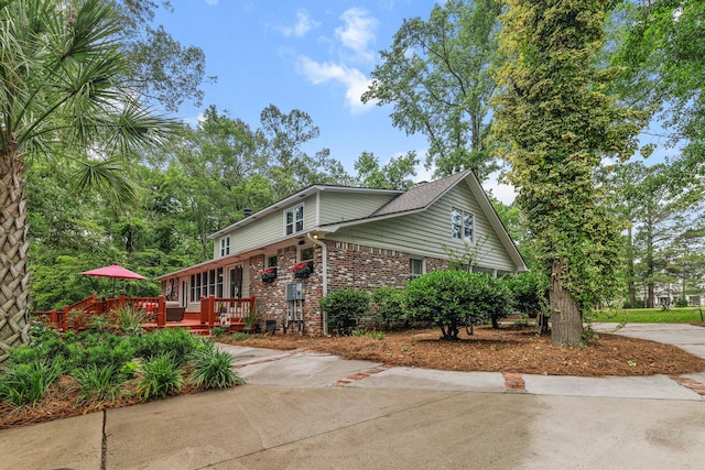 206 Chaussee Blvd, Summerville, SC 29483 - view of home's exterior with brick siding and a wooden deck