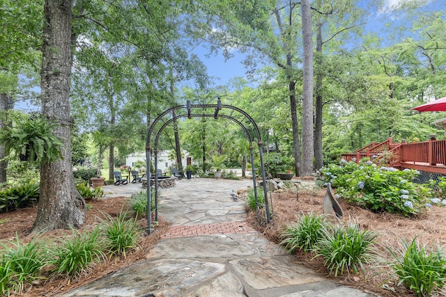 206 Chaussee Blvd, Summerville, SC 29483 - gate with view of scattered trees and a wooden deck