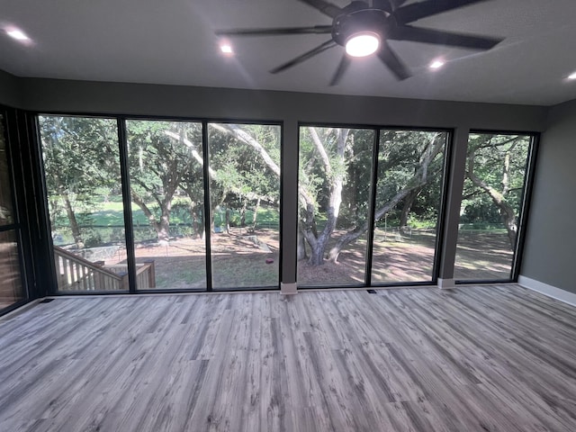 interior space with ceiling fan and light wood-type flooring