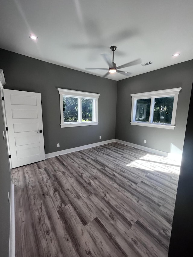 unfurnished room featuring ceiling fan and wood-type flooring