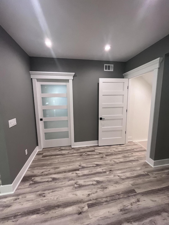 entryway with wood-type flooring