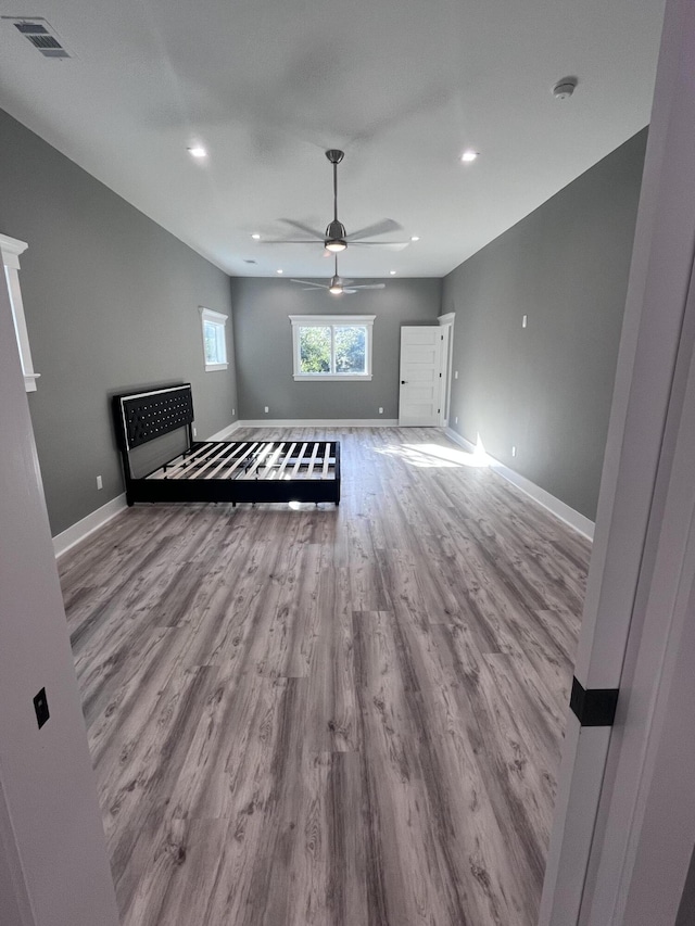 unfurnished bedroom featuring ceiling fan and light hardwood / wood-style floors