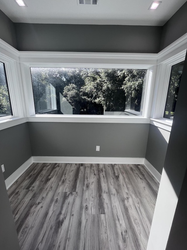 unfurnished room featuring hardwood / wood-style flooring