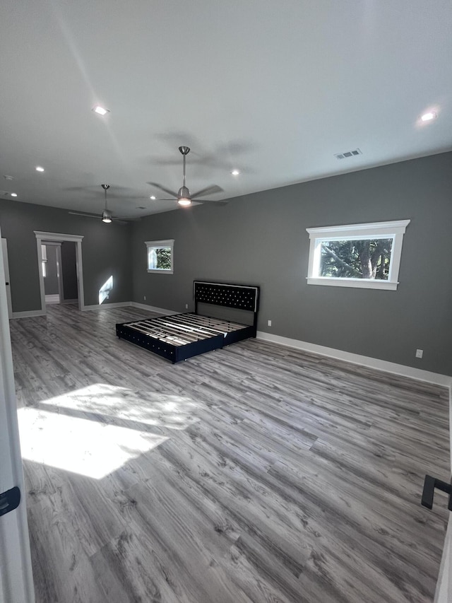 interior space featuring hardwood / wood-style flooring, a wealth of natural light, and ceiling fan