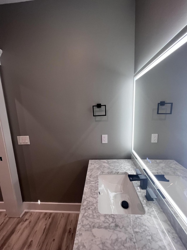 bathroom with vanity and hardwood / wood-style floors