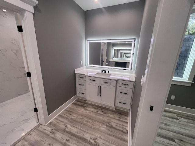 bathroom featuring vanity and hardwood / wood-style floors