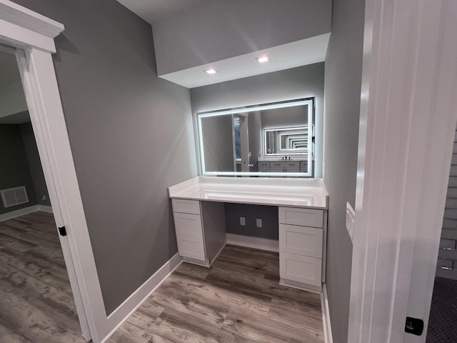 bathroom featuring wood-type flooring and vanity