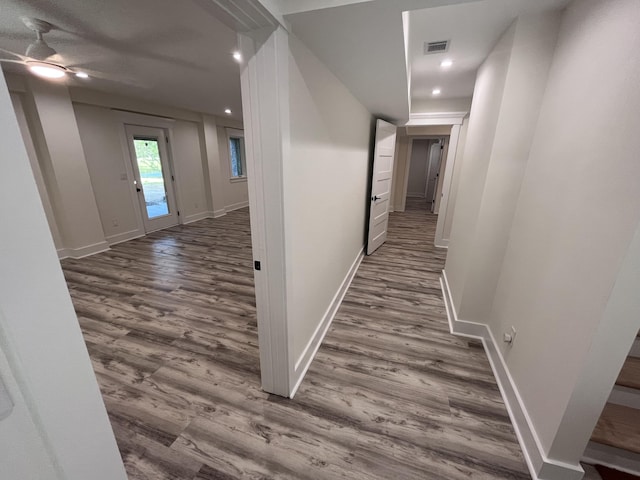 hall with hardwood / wood-style flooring