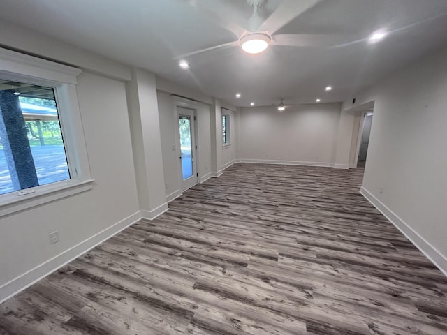 interior space featuring wood-type flooring and ceiling fan