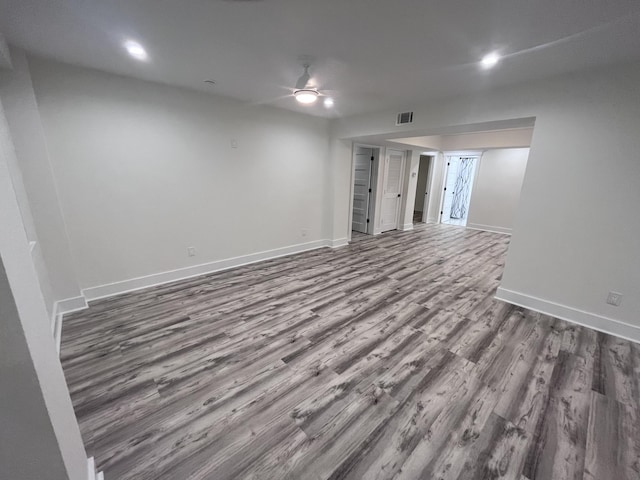 spare room with wood-type flooring and ceiling fan