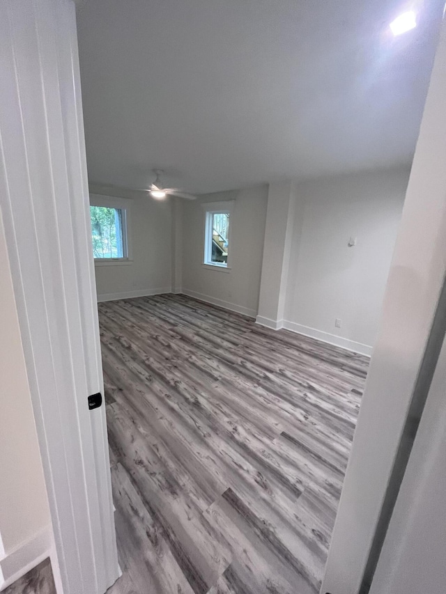 spare room featuring hardwood / wood-style flooring and ceiling fan