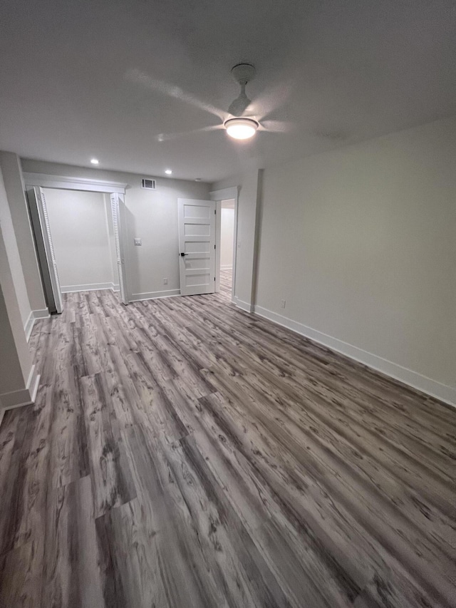 spare room featuring hardwood / wood-style flooring and ceiling fan