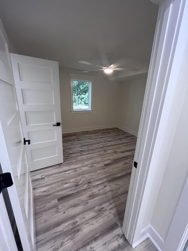 spare room featuring hardwood / wood-style floors and ceiling fan