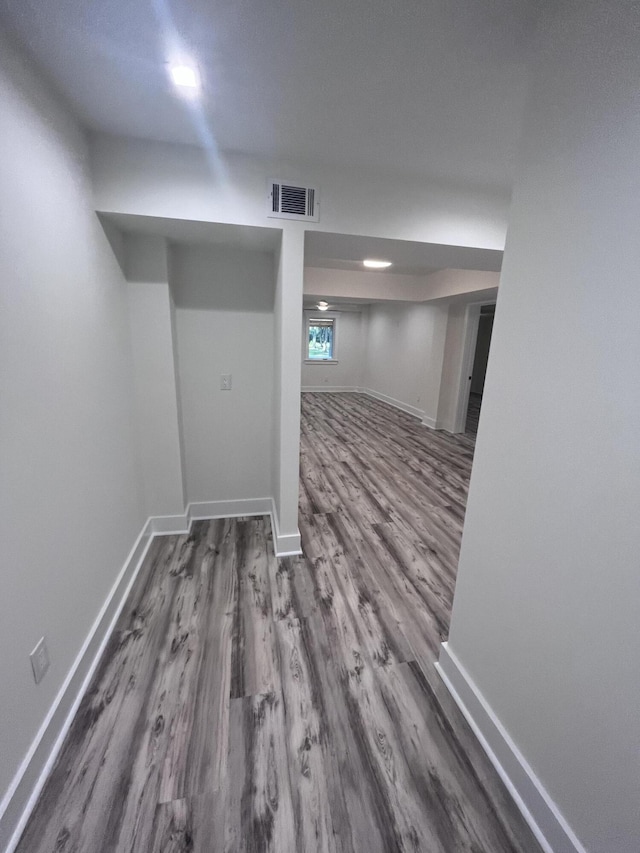 basement featuring hardwood / wood-style floors