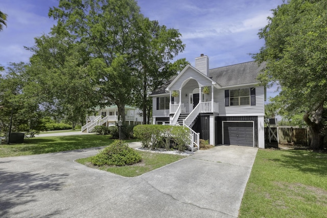 633 Stono Edge Dr, Charleston, SC 29412 - raised beach house featuring stairs, driveway, a porch, and a chimney