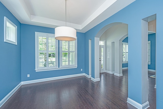 1721 Wellstead St, Mount Pleasant, SC 29466 - unfurnished room with a raised ceiling, wood-type flooring, and arched walkways